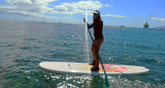 woman paddle boarding on Maui